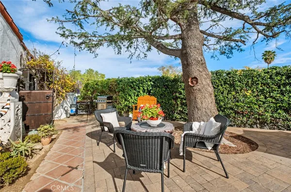 a view of backyard with sitting space
