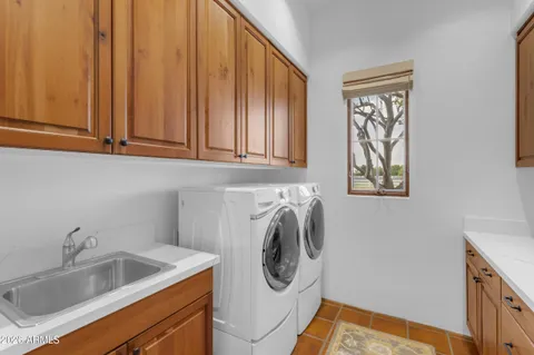 a bathroom with a sink double vanity and a mirror