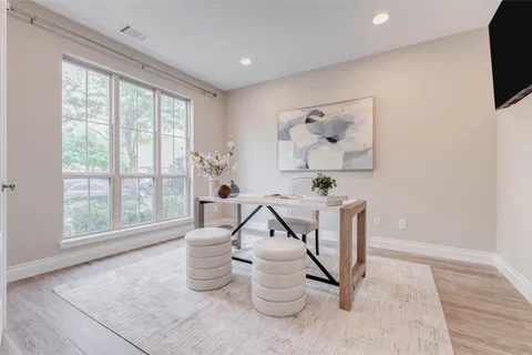 a spacious bathroom with a bathtub and a shower