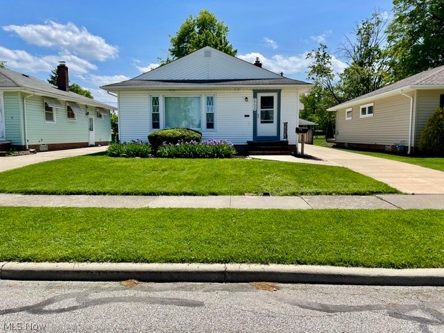 28634 Forest Road Willowick, OH 44095 - Photo 2 of 39 White siding residence featuring a front lawn, sidewalk, and concrete driveway