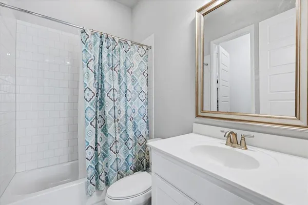 a bathroom with a sink a toilet and a bathtub