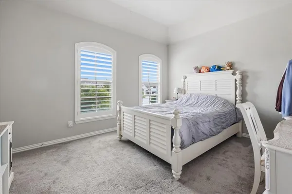 a room with a bed and a chair