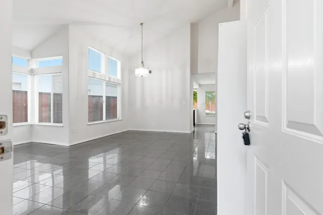 a view of an entryway with wooden floor