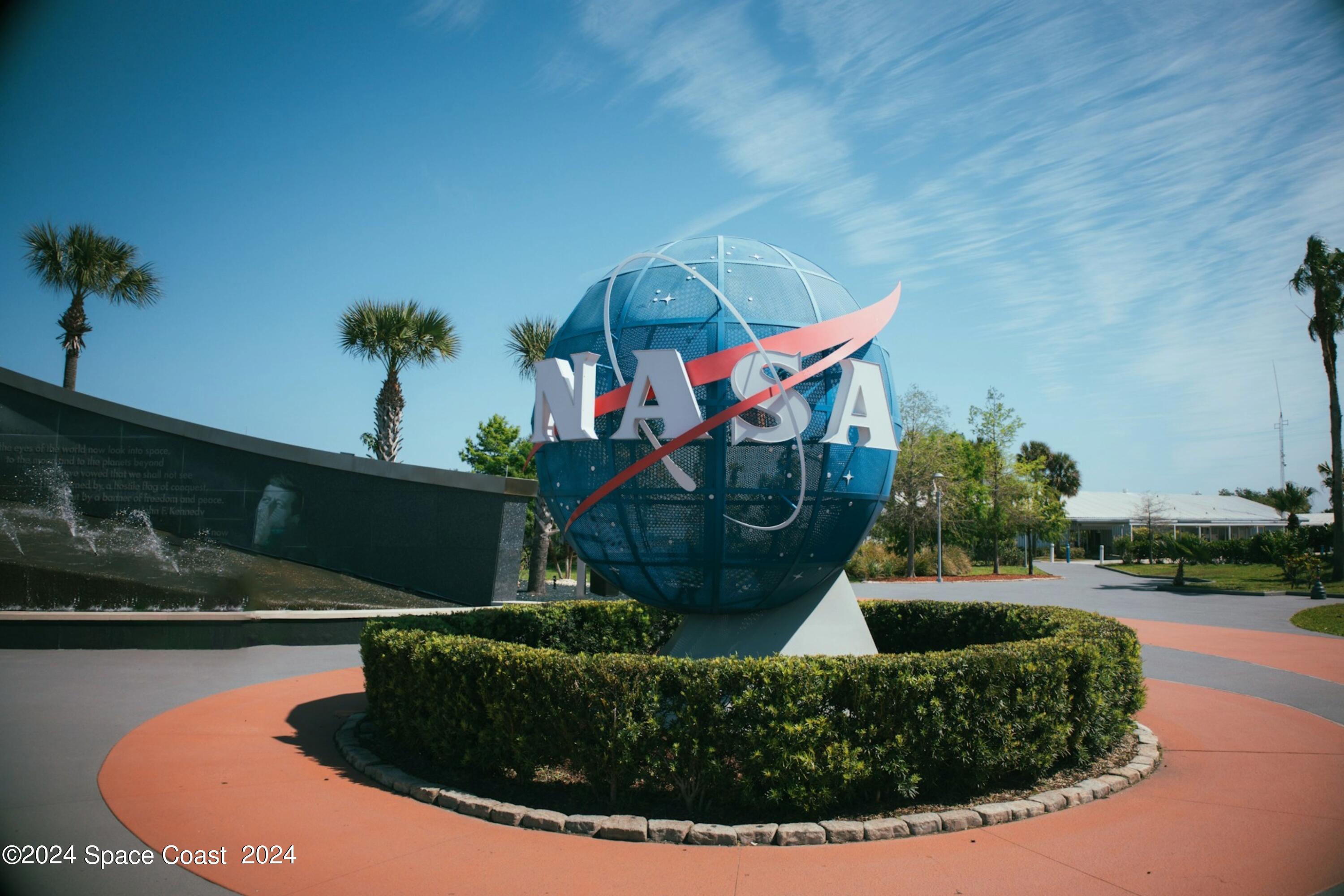 115 Seminole Avenue West, Unit 209 Melbourne, FL 32901 - Photo 11 of 23 a view of a house with a swimming pool