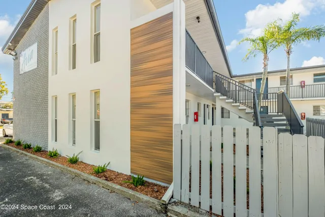 a view of swimming pool with outdoor seating and city view