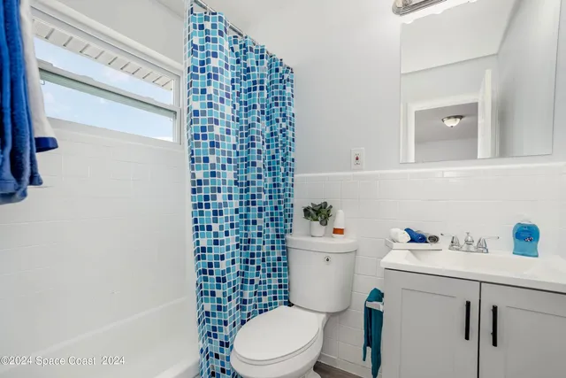 a view of a swimming pool with a lounge chair