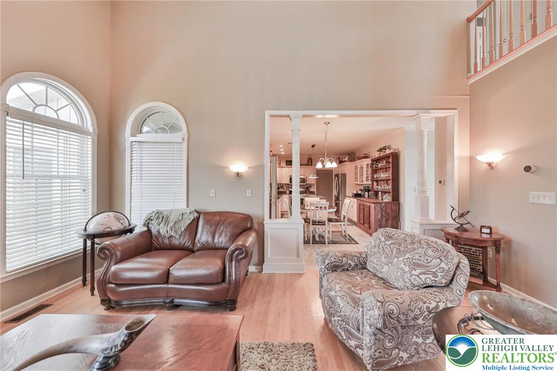63 Long Road Lenhartsville, PA 19534 - Photo 40 of 100 High ceilings and arched windows define this airy open-concept living area.