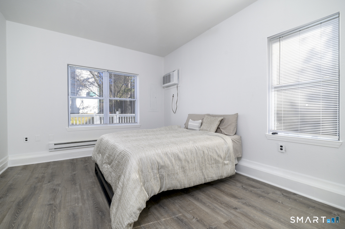 905 Oronoke Road, Unit 13 Waterbury, CT 06708 - Photo 16 of 28 a bedroom with a bed and a window