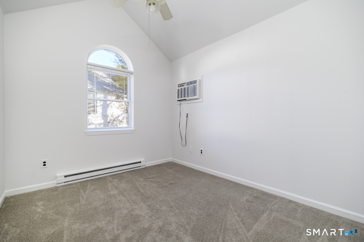 905 Oronoke Road, Unit 13 Waterbury, CT 06708 - Photo 20 of 28 an empty room with windows