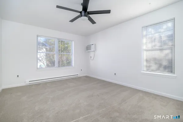 an empty room with window and windows