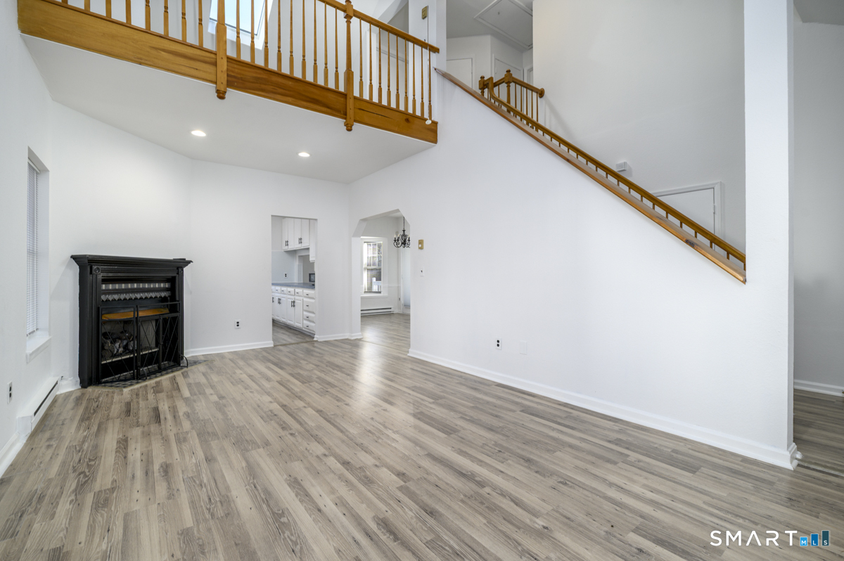 905 Oronoke Road, Unit 13 Waterbury, CT 06708 - Photo 8 of 28 a view of empty room with wooden floor