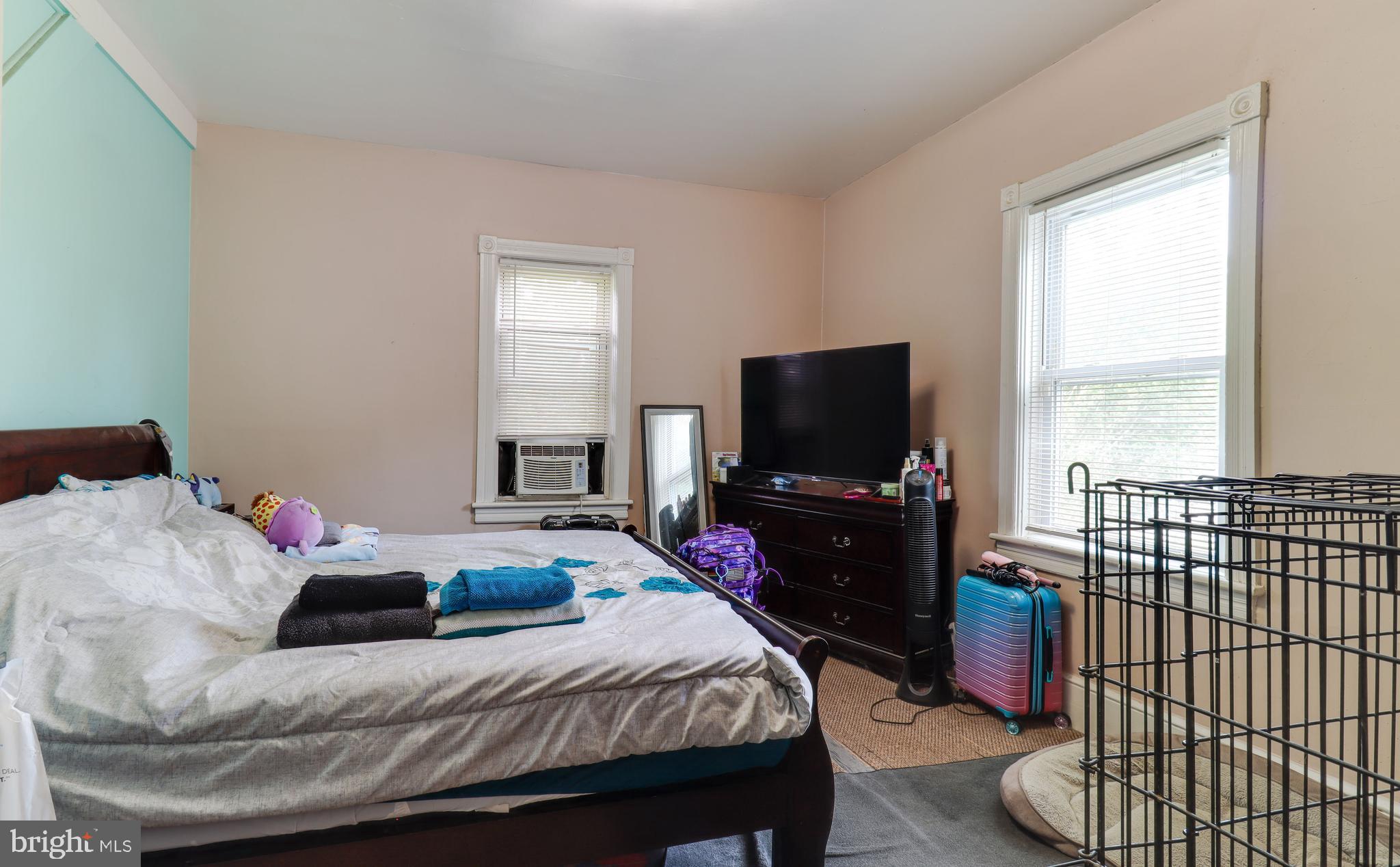 20 Deptford Road Glassboro, NJ 08028 - Photo 10 of 17 a bedroom with a bed and a flat screen tv
