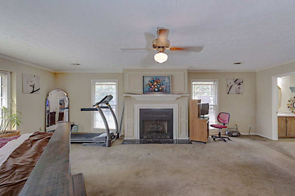994 Ga Highway Fortson, GA 31808 - Photo 15 of 46 a view of a livingroom with furniture and a fireplace