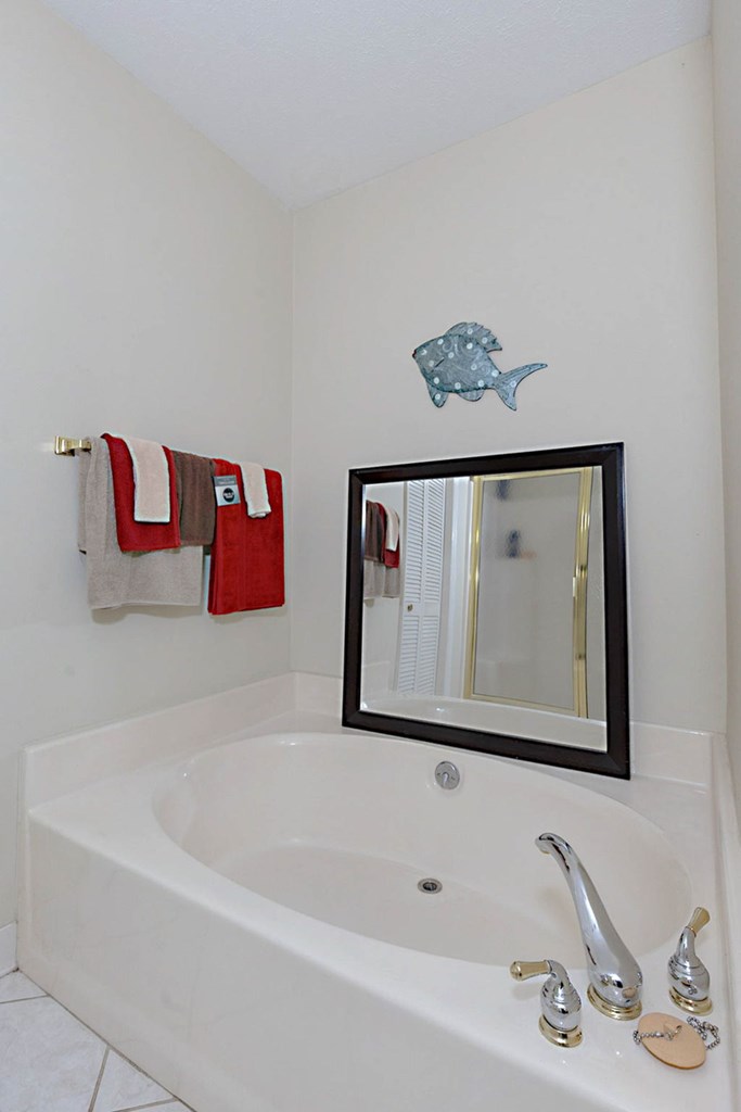 994 Ga Highway Fortson, GA 31808 - Photo 20 of 46 a bathroom with a bathtub and a sink
