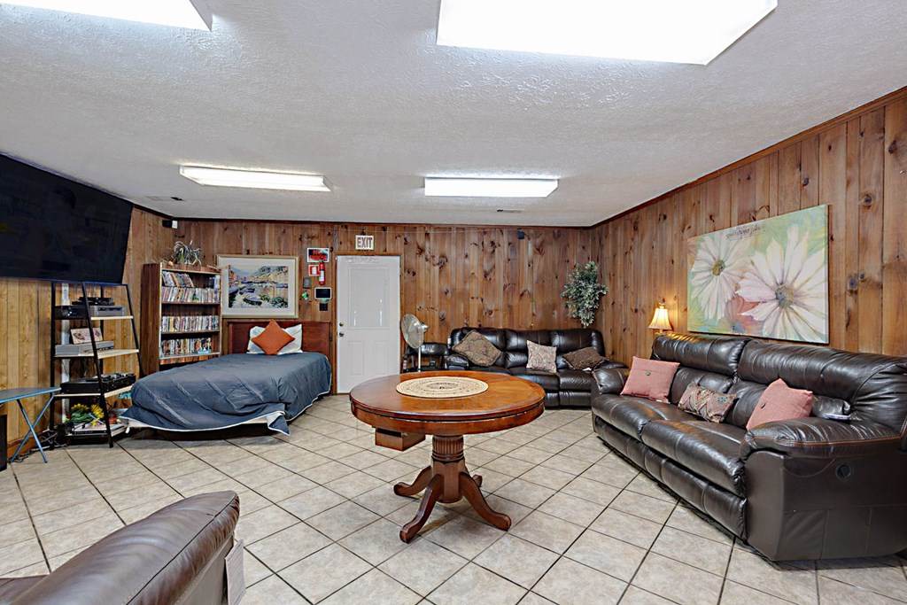 994 Ga Highway Fortson, GA 31808 - Photo 25 of 46 a living room with furniture a rug and a wall painting