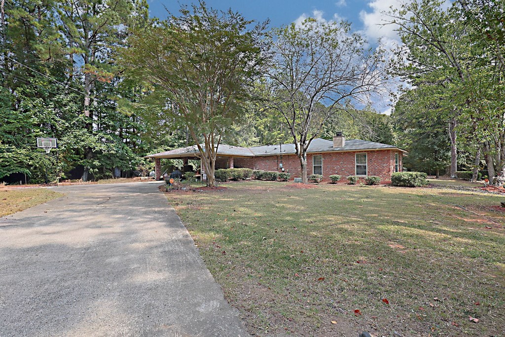 994 Ga Highway Fortson, GA 31808 - Photo 3 of 46 a front view of a house with garden