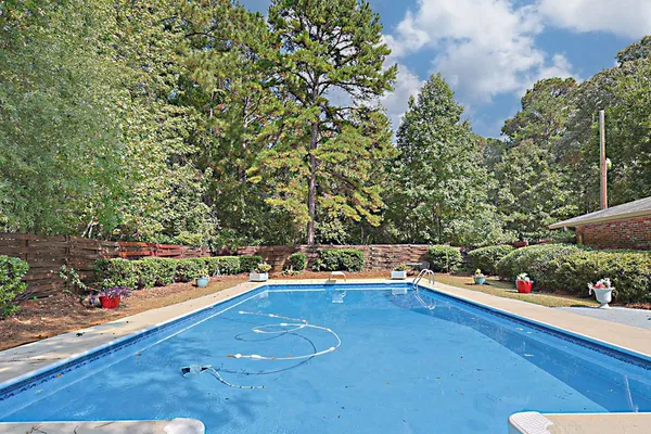 a big yard with large trees