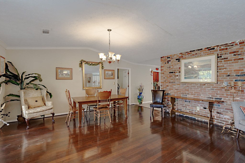 994 Ga Highway Fortson, GA 31808 - Photo 5 of 46 a view of a dining room with furniture chandelier and wooden floor