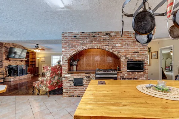 a kitchen with a stove a sink and a refrigerator