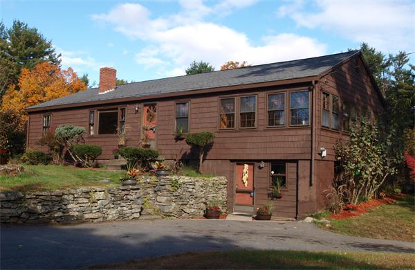 91 Randall Road Berlin, MA 01503 - Photo 1 of 30 a front view of a house with garden