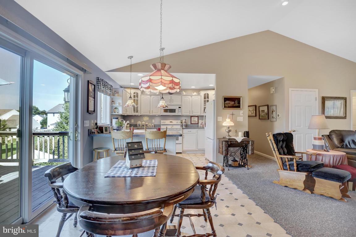 12 Sunset Lane Lititz, PA 17543 - Photo 13 of 34 a dining room with furniture a floor to ceiling window and wooden floor