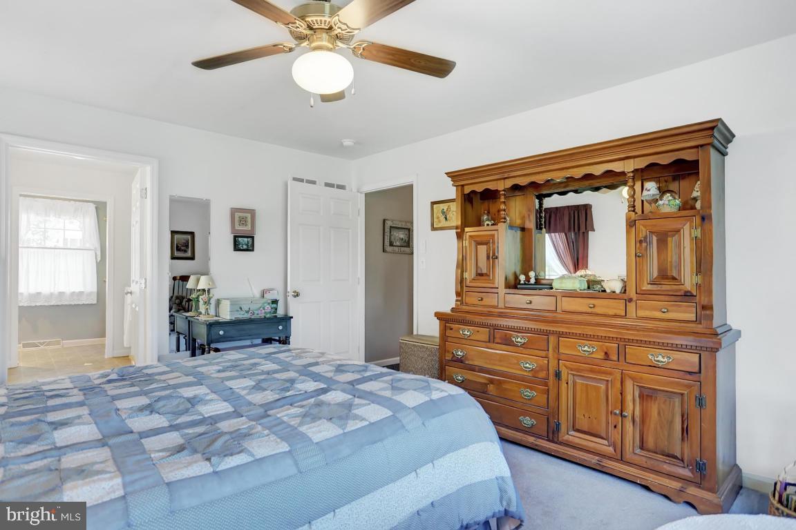 12 Sunset Lane Lititz, PA 17543 - Photo 17 of 34 a bedroom with a large bed and a chandelier