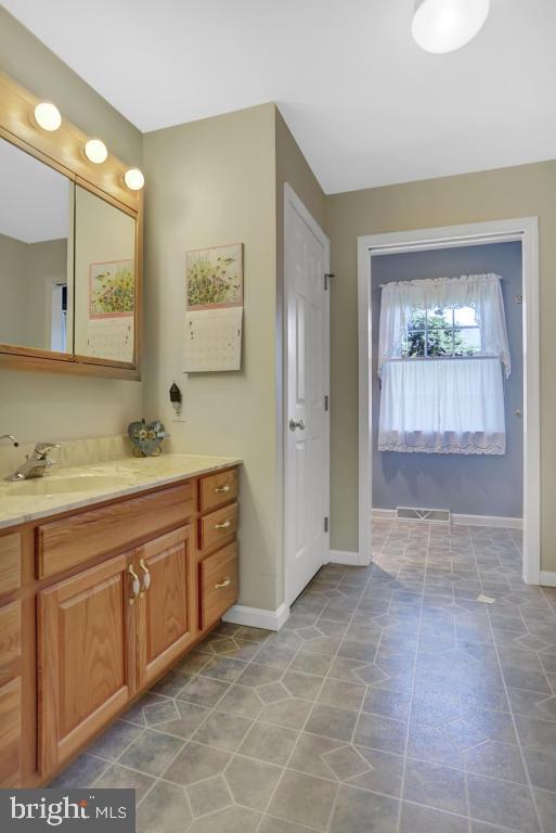 12 Sunset Lane Lititz, PA 17543 - Photo 19 of 34 a spacious bathroom with a mirror sink and shower