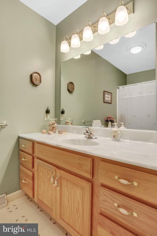 12 Sunset Lane Lititz, PA 17543 - Photo 22 of 34 a bathroom with a sink vanity and a mirror