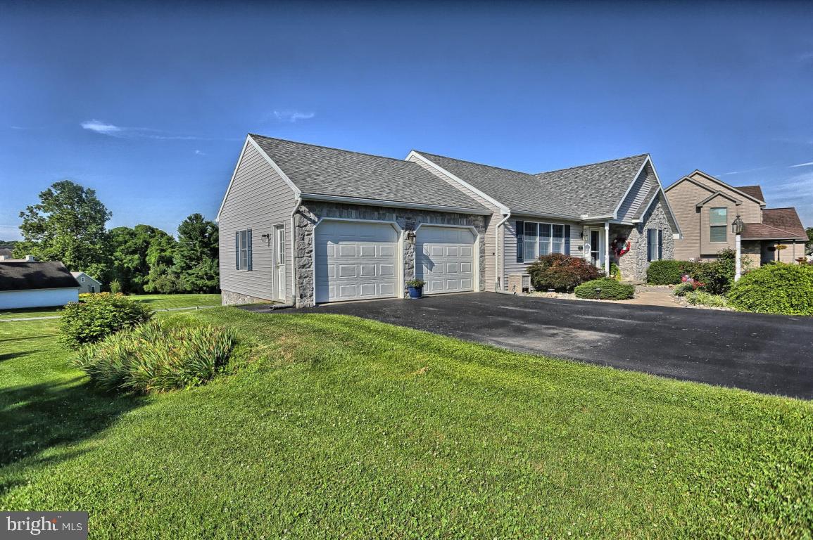 12 Sunset Lane Lititz, PA 17543 - Photo 4 of 34 a front view of a house with a yard