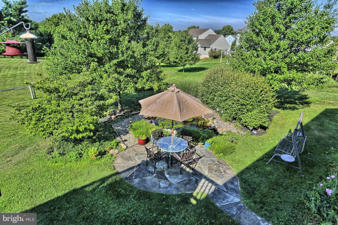 12 Sunset Lane Lititz, PA 17543 - Photo 34 of 34 a view of a table and chairs in backyard