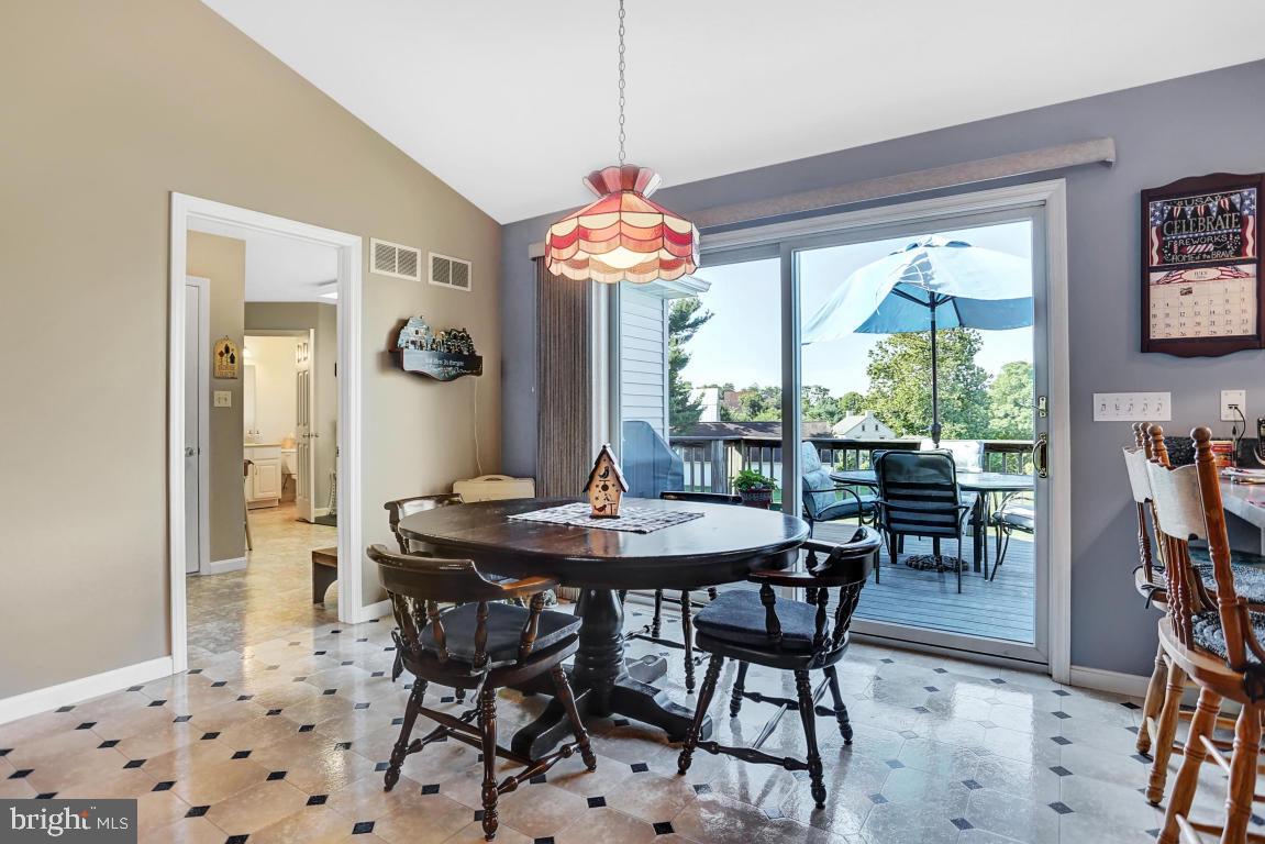 12 Sunset Lane Lititz, PA 17543 - Photo 8 of 34 a dining room with furniture a chandelier and a rug