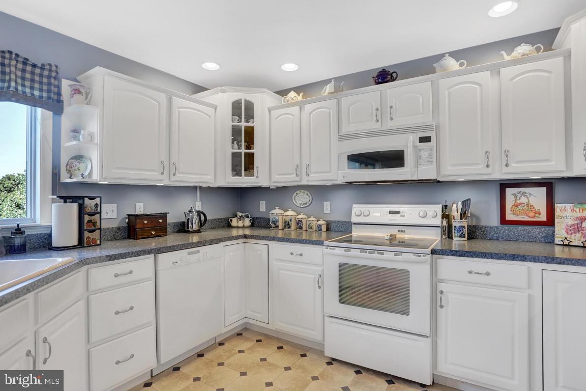12 Sunset Lane Lititz, PA 17543 - Photo 10 of 34 a kitchen with stainless steel appliances granite countertop white cabinets sink and stove