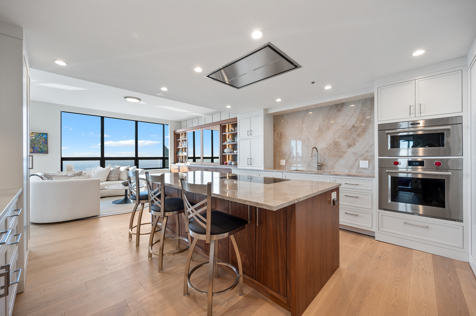180 East Pearson Street, Unit 6907 Chicago, IL 60611 - Photo 14 of 44 a kitchen with stainless steel appliances kitchen island granite countertop a table chairs and a refrigerator