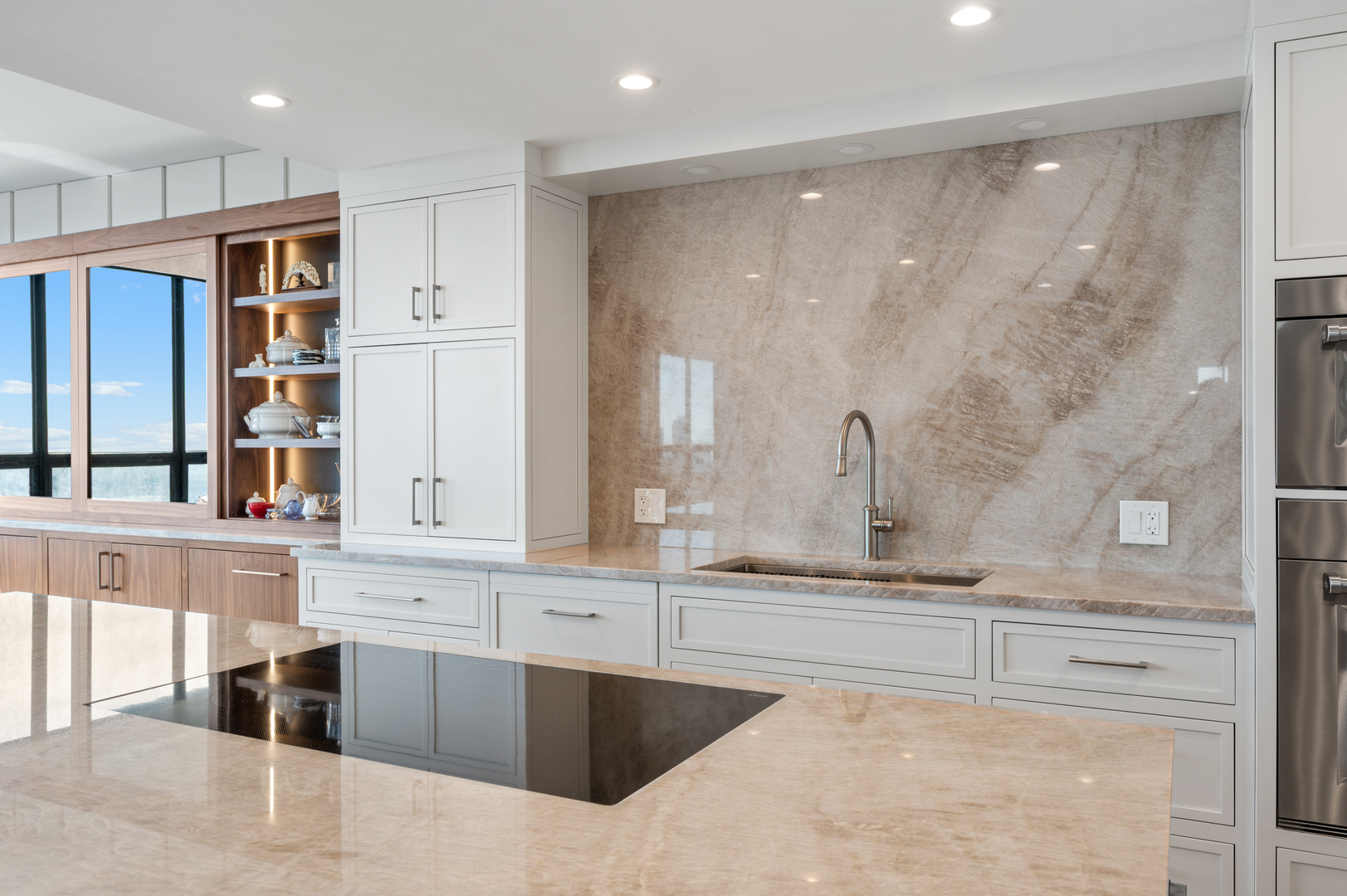 180 East Pearson Street, Unit 6907 Chicago, IL 60611 - Photo 15 of 44 a large white kitchen with a large window