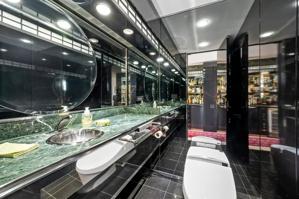 a lobby with a couch and a rug