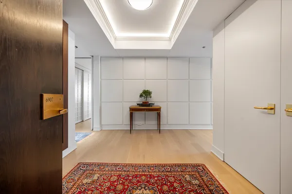 a bedroom with a bed and a lamp on table