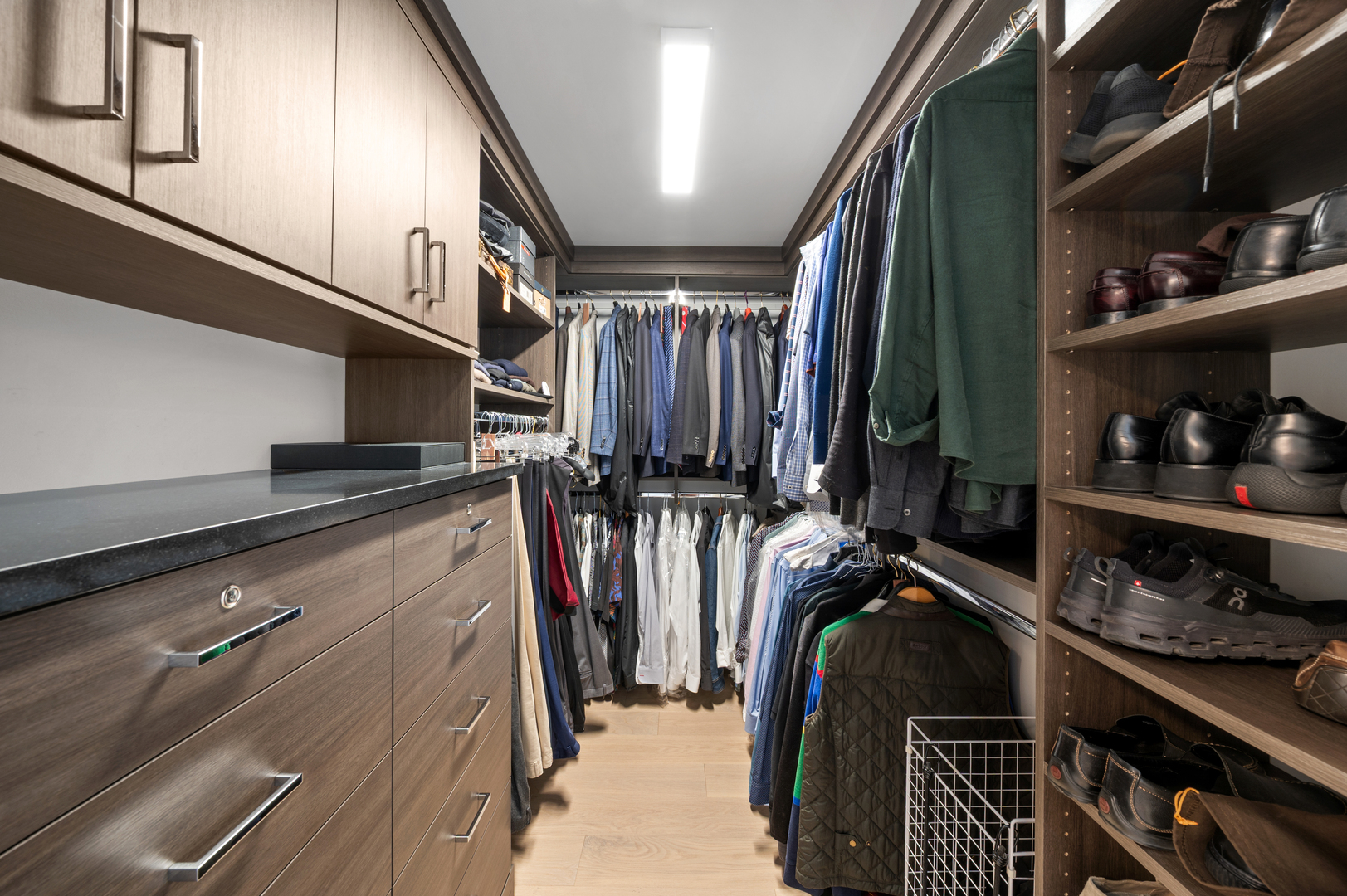 180 East Pearson Street, Unit 6907 Chicago, IL 60611 - Photo 25 of 44 a view of walk in closet with clothes and shoes
