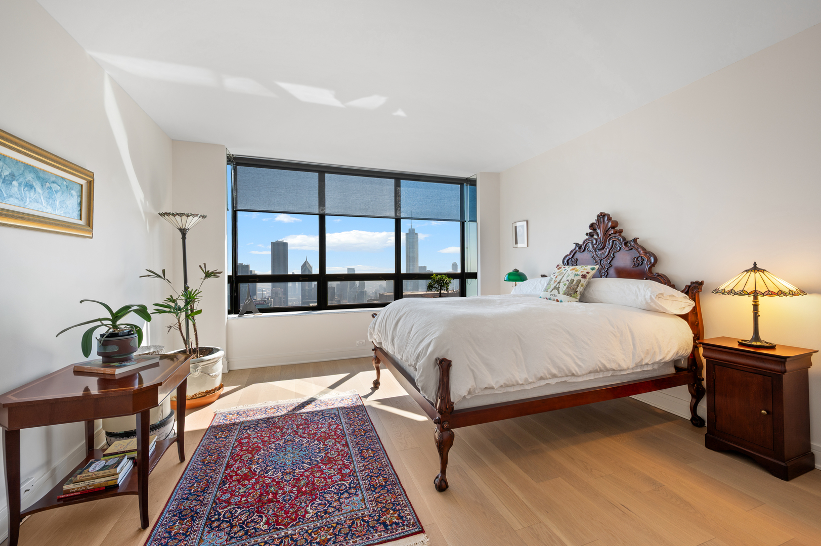 180 East Pearson Street, Unit 6907 Chicago, IL 60611 - Photo 28 of 44 a bed room with a bed and a potted plant