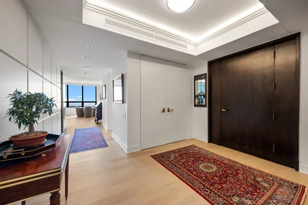 a living room with furniture and a rug