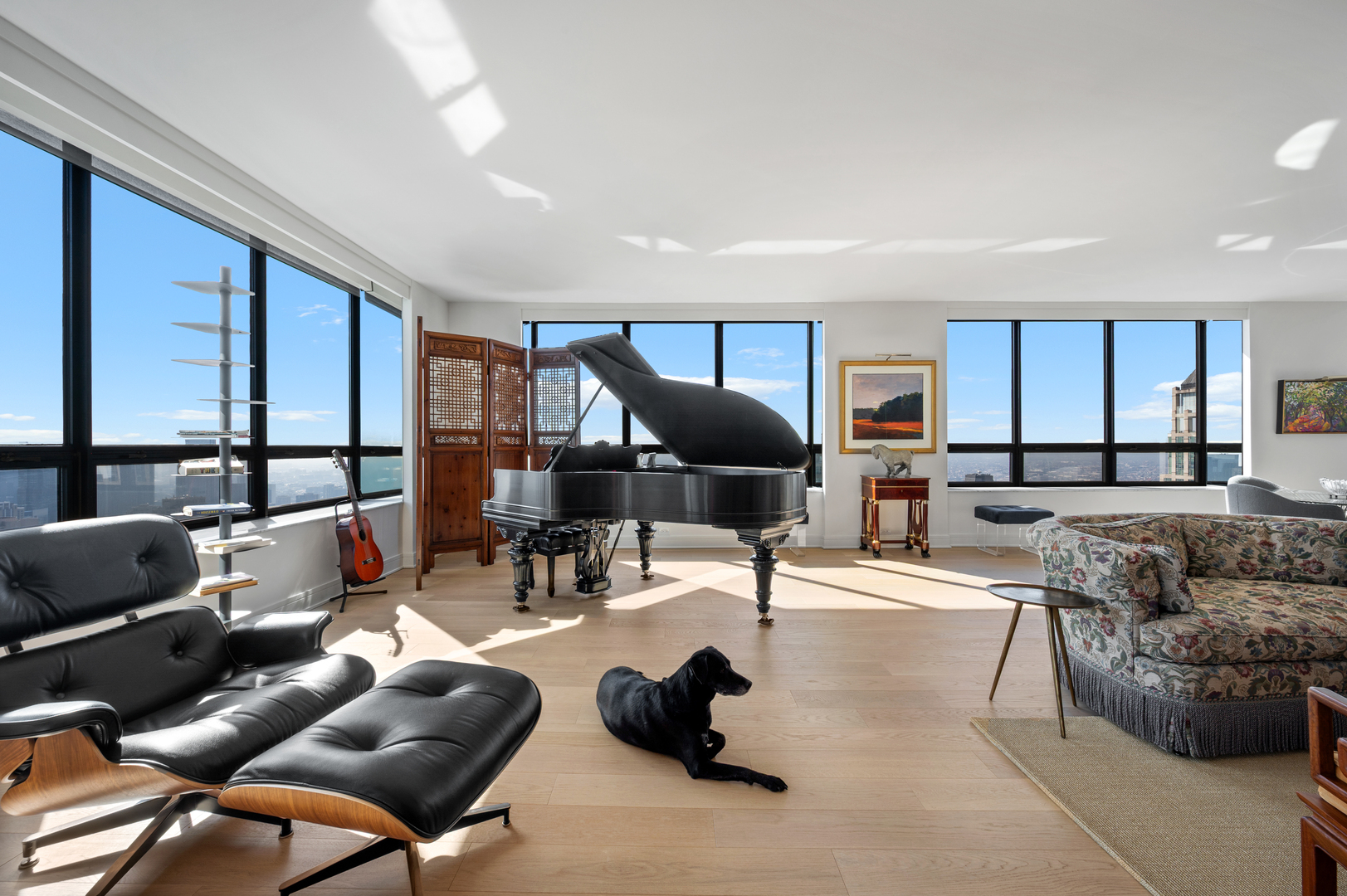 180 East Pearson Street, Unit 6907 Chicago, IL 60611 - Photo 5 of 44 a living room with furniture and a large window