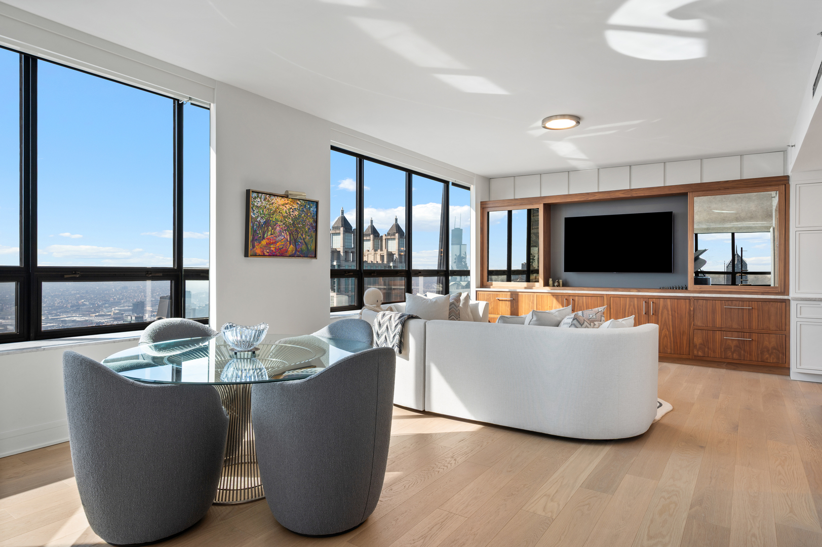 180 East Pearson Street, Unit 6907 Chicago, IL 60611 - Photo 6 of 44 a living room with furniture and a flat screen tv