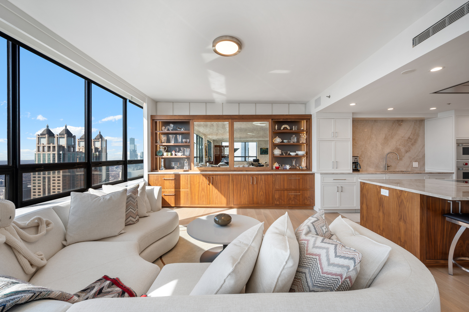 180 East Pearson Street, Unit 6907 Chicago, IL 60611 - Photo 10 of 44 a living room with furniture kitchen view and large windows