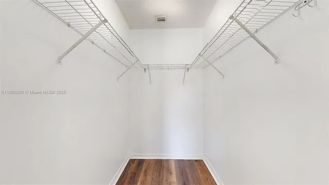 a bathroom with a sink toilet and a mirror