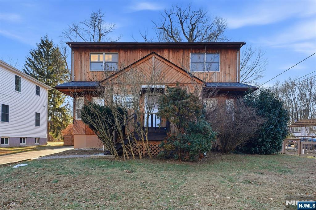 31 West Street Closter, NJ 07624 - Photo 1 of 18 a house that has a tree in front of it