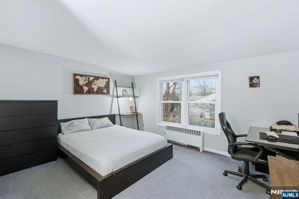 31 West Street Closter, NJ 07624 - Photo 13 of 18 a bedroom with a bed a desk and chair