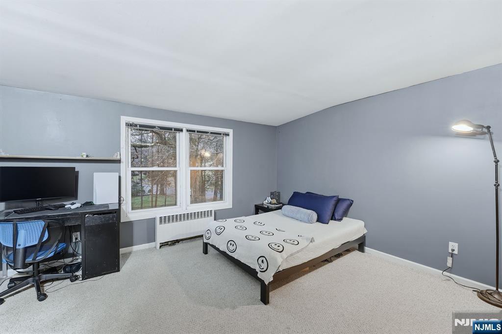 31 West Street Closter, NJ 07624 - Photo 14 of 18 a bedroom with a bed and a desk