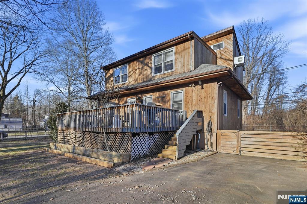 31 West Street Closter, NJ 07624 - Photo 16 of 18 a view of a house with a wooden fence