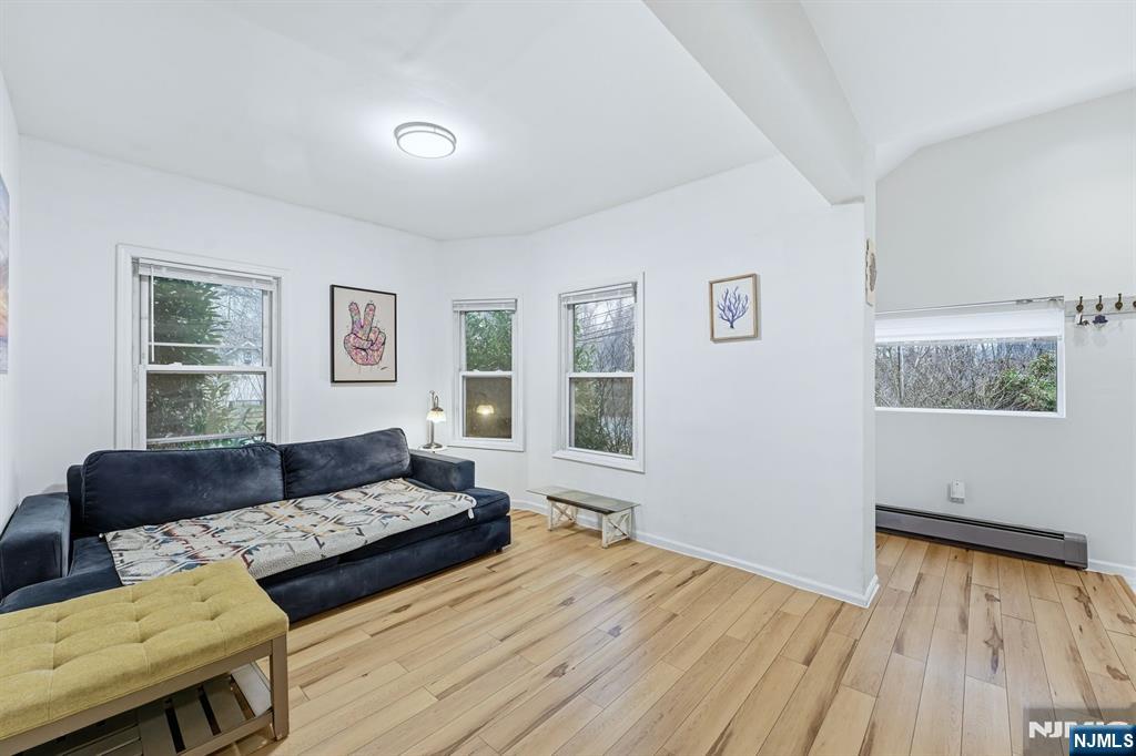 31 West Street Closter, NJ 07624 - Photo 4 of 18 a living room with furniture and a wooden floor