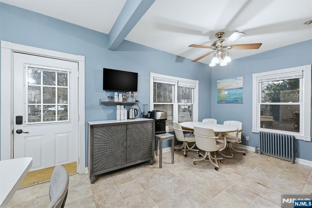 31 West Street Closter, NJ 07624 - Photo 7 of 18 a living room with furniture a window and a flat screen tv