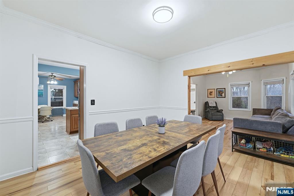 31 West Street Closter, NJ 07624 - Photo 8 of 18 a dining hall with granite countertop a dining table and chairs with wooden floor